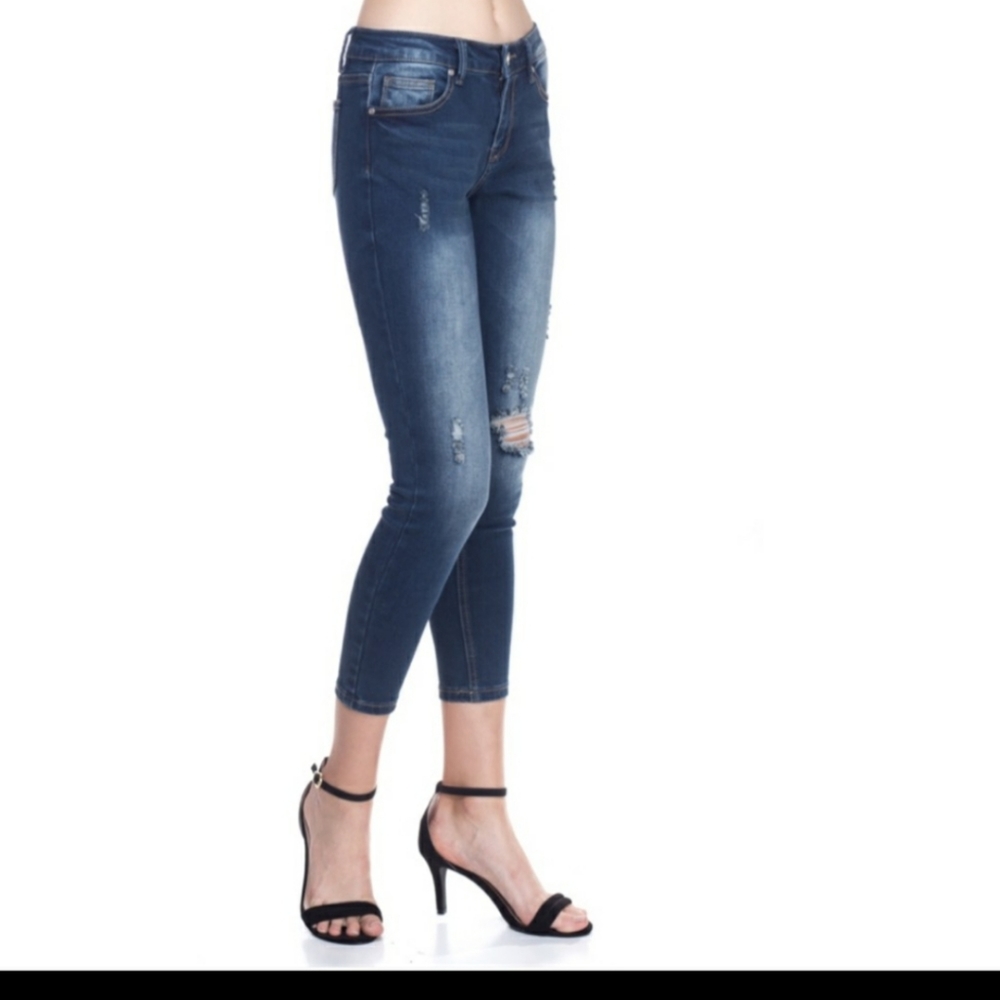 Mid-rise destroyed jeans.